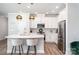 Modern kitchen with a white countertop island, stainless steel appliances, and pendant lighting at 355 Ladybird Ln, Pineville, NC 28134