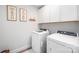 This laundry room features a new-looking washer and dryer and painted walls at 355 Ladybird Ln, Pineville, NC 28134
