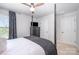 This bedroom features a four-poster bed, a dresser with a TV, and two doors at 355 Ladybird Ln, Pineville, NC 28134