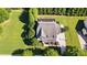 Aerial view of the home showcasing its well-maintained lawn and solar panels at 3808 Halcyon Dr, Huntersville, NC 28078