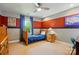 Cozy bedroom features colorful decor, a comfortable bed, and ample natural light at 3808 Halcyon Dr, Huntersville, NC 28078