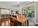Dining room with wood table, four chairs, and sliding glass door leading to the patio at 3808 Halcyon Dr, Huntersville, NC 28078