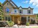 Charming two-story home with brick and vinyl siding, and a well-manicured front yard at 3808 Halcyon Dr, Huntersville, NC 28078
