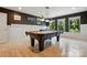 Game room featuring a pool table, wainscoting, hardwood floors, and lots of natural light at 3808 Halcyon Dr, Huntersville, NC 28078