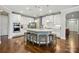 Spacious kitchen with large island, stainless steel appliances, and seating for four at 3808 Halcyon Dr, Huntersville, NC 28078