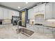 Close up of kitchen island with granite counters, stainless steel appliances, and under cabinet lighting at 3808 Halcyon Dr, Huntersville, NC 28078