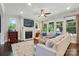 Cozy living room with a fireplace, tv, recessed lights, a ceiling fan, and lots of natural light at 3808 Halcyon Dr, Huntersville, NC 28078