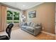 Neutral living room with sofa, picture window and natural light at 3808 Halcyon Dr, Huntersville, NC 28078