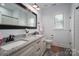 Bright bathroom featuring double sinks with granite countertops and large mirror at 4143 Willow Haven Dr, Denver, NC 28037