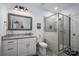 Modern bathroom with a stand-up shower and a sleek granite sink at 4143 Willow Haven Dr, Denver, NC 28037