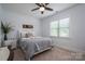 Cozy bedroom with a large window and comfortable bed at 4143 Willow Haven Dr, Denver, NC 28037
