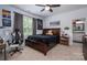 Comfortable bedroom with a large bed, gaming chair, and en suite bathroom at 4143 Willow Haven Dr, Denver, NC 28037