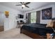 Bedroom featuring a sleek TV and study desk near the window at 4143 Willow Haven Dr, Denver, NC 28037