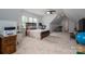 Large attic bonus room with a bed, a treadmill, and extra space at 4143 Willow Haven Dr, Denver, NC 28037