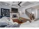 Spacious living room showcasing hardwood floors, a stone fireplace, and easy access to the staircase at 4143 Willow Haven Dr, Denver, NC 28037