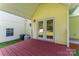 A covered porch with access to the house and views of the lawn at 4499 Briarcreek Rd, Maiden, NC 28650