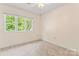 Cozy bedroom with carpet flooring, large windows, and ample natural light at 4499 Briarcreek Rd, Maiden, NC 28650