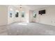 Bright bedroom featuring multiple windows, neutral carpet, and overhead fan at 4499 Briarcreek Rd, Maiden, NC 28650