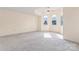 Spacious bedroom with carpet flooring and arched windows bringing in natural light at 4499 Briarcreek Rd, Maiden, NC 28650