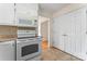 Cozy kitchen featuring white appliances and cabinetry, with plenty of storage at 4499 Briarcreek Rd, Maiden, NC 28650