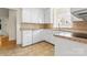 Cozy kitchen with white cabinetry, tile countertops, and modern appliances at 4499 Briarcreek Rd, Maiden, NC 28650