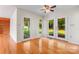 Bright living area with hardwood floors and french doors that lead to the backyard at 4499 Briarcreek Rd, Maiden, NC 28650