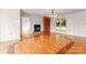 Inviting living room featuring hardwood floors, fireplace with mantel, and a built-in bookshelf at 4499 Briarcreek Rd, Maiden, NC 28650