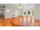 Spacious living room featuring hardwood floors and lots of natural light from many windows at 4499 Briarcreek Rd, Maiden, NC 28650