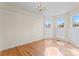 Bright living room featuring hardwood floors, neutral paint, and abundant natural light at 4499 Briarcreek Rd, Maiden, NC 28650