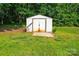 Outdoor storage shed with double doors and a small concrete platform at 4499 Briarcreek Rd, Maiden, NC 28650