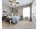 Bedroom with neutral walls, a window, and carpeted floors at 4683 Dunberry Sw Pl, Concord, NC 28027