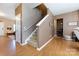 Welcoming foyer with hardwood floors, staircase, and decorative details at 4683 Dunberry Sw Pl, Concord, NC 28027
