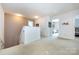 Upstairs hallway, carpeted with multiple entryways at 4683 Dunberry Sw Pl, Concord, NC 28027