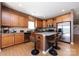 The kitchen features granite countertops, stainless steel appliances and hardwood floors at 4683 Dunberry Sw Pl, Concord, NC 28027