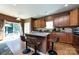 The kitchen has hardwood floors, a center island, granite countertops and stainless steel appliances at 4683 Dunberry Sw Pl, Concord, NC 28027