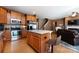 Open concept kitchen with stainless steel appliances, island and view to living room at 4683 Dunberry Sw Pl, Concord, NC 28027