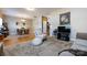 Open concept living area with wood floors, comfortable seating, and a dining area, perfect for modern living at 4683 Dunberry Sw Pl, Concord, NC 28027