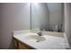 Half bathroom with a vanity, sink, and large mirror that enhances the space at 4728 Cottage Oaks Dr, Charlotte, NC 28269