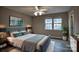 This bedroom boasts a large bed, stylish decor, and plenty of natural light from the double windows at 4728 Cottage Oaks Dr, Charlotte, NC 28269