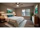 This spacious bedroom features modern decor, wood floors, and bright natural light from a window at 4728 Cottage Oaks Dr, Charlotte, NC 28269