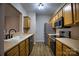 Well-equipped kitchen featuring stainless steel appliances, wooden cabinets, and neutral countertops at 4728 Cottage Oaks Dr, Charlotte, NC 28269