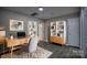 Stylish home office with a modern desk, bookshelves, and neutral decor at 4728 Cottage Oaks Dr, Charlotte, NC 28269