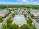 Aerial view of the community pool, seating, and surrounding neighborhood at 4848 Fonthill Ln, Charlotte, NC 28210