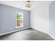 Bedroom with painted accent wall, modern ceiling fan, and vinyl flooring at 4848 Fonthill Ln, Charlotte, NC 28210