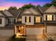 Charming townhome with stone accents, garage, and well-maintained landscaping at 4848 Fonthill Ln, Charlotte, NC 28210