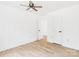 Bright bedroom features a ceiling fan, sleek floors, and white walls at 4905 Chestnut Lake Dr, Charlotte, NC 28227