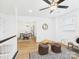 Versatile sitting area leading to dining room, offering a relaxed atmosphere with modern decor and natural light at 4905 Chestnut Lake Dr, Charlotte, NC 28227