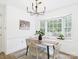 Charming dining room with a modern chandelier and large window views at 4905 Chestnut Lake Dr, Charlotte, NC 28227