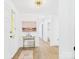 Inviting foyer with a decorative rug, modern light fixture, and fresh, white paint at 4905 Chestnut Lake Dr, Charlotte, NC 28227