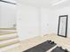 Spacious home gym with light wood floors, minimalist design, and natural light at 4905 Chestnut Lake Dr, Charlotte, NC 28227